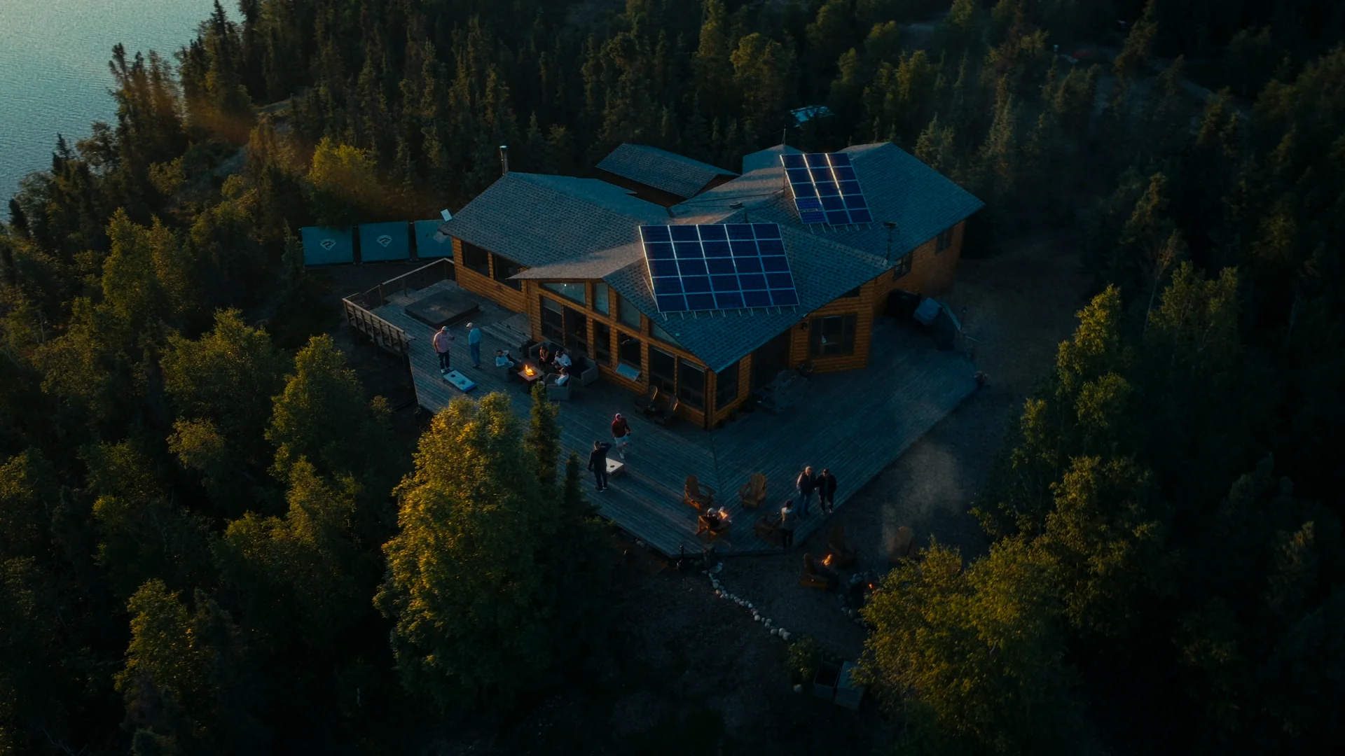 Scott Lake Lodge from above at dusk, surrounded by forest