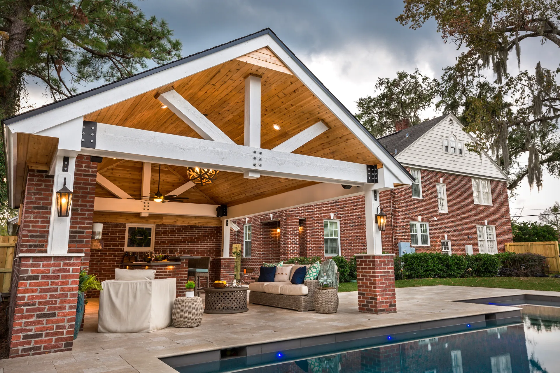 A Pratt Guys covered outdoor pavilion beside a pool