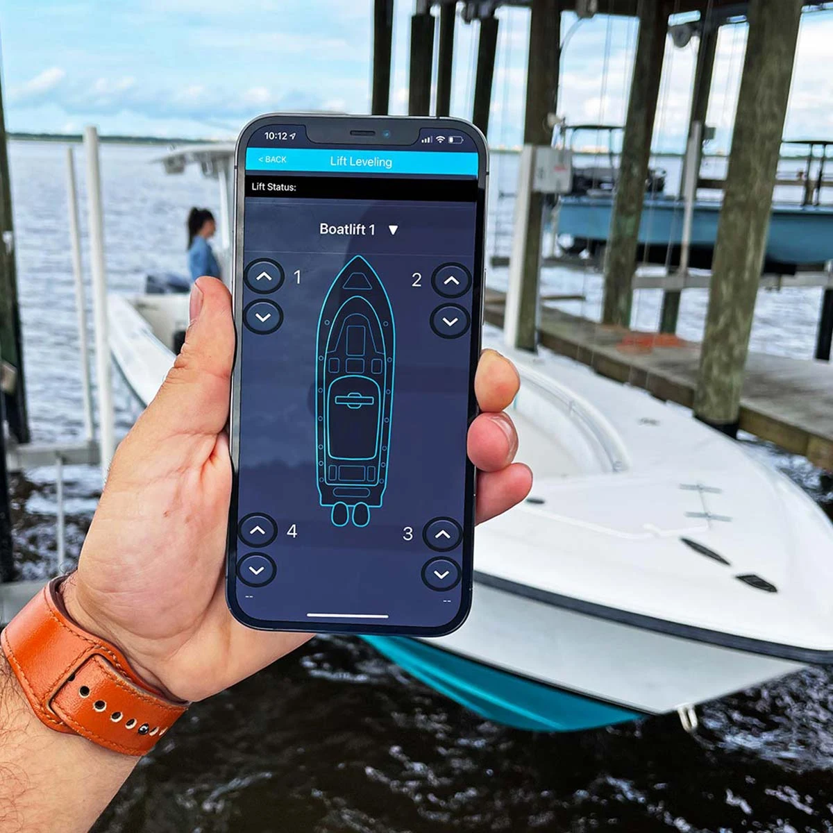 Premier Remotes boat controls on a phone held aboard a boat