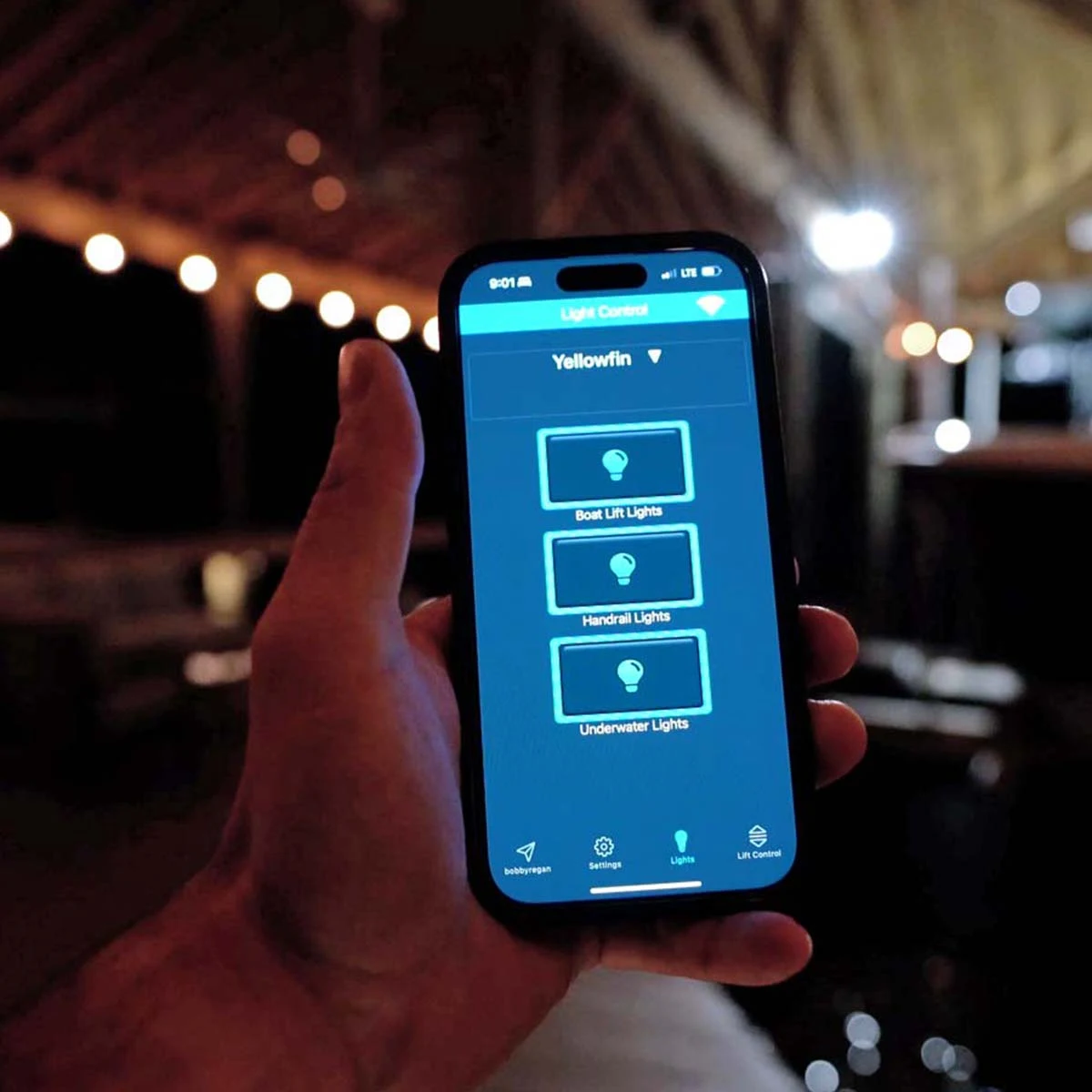 Premier Remotes phone interface photographed after dark