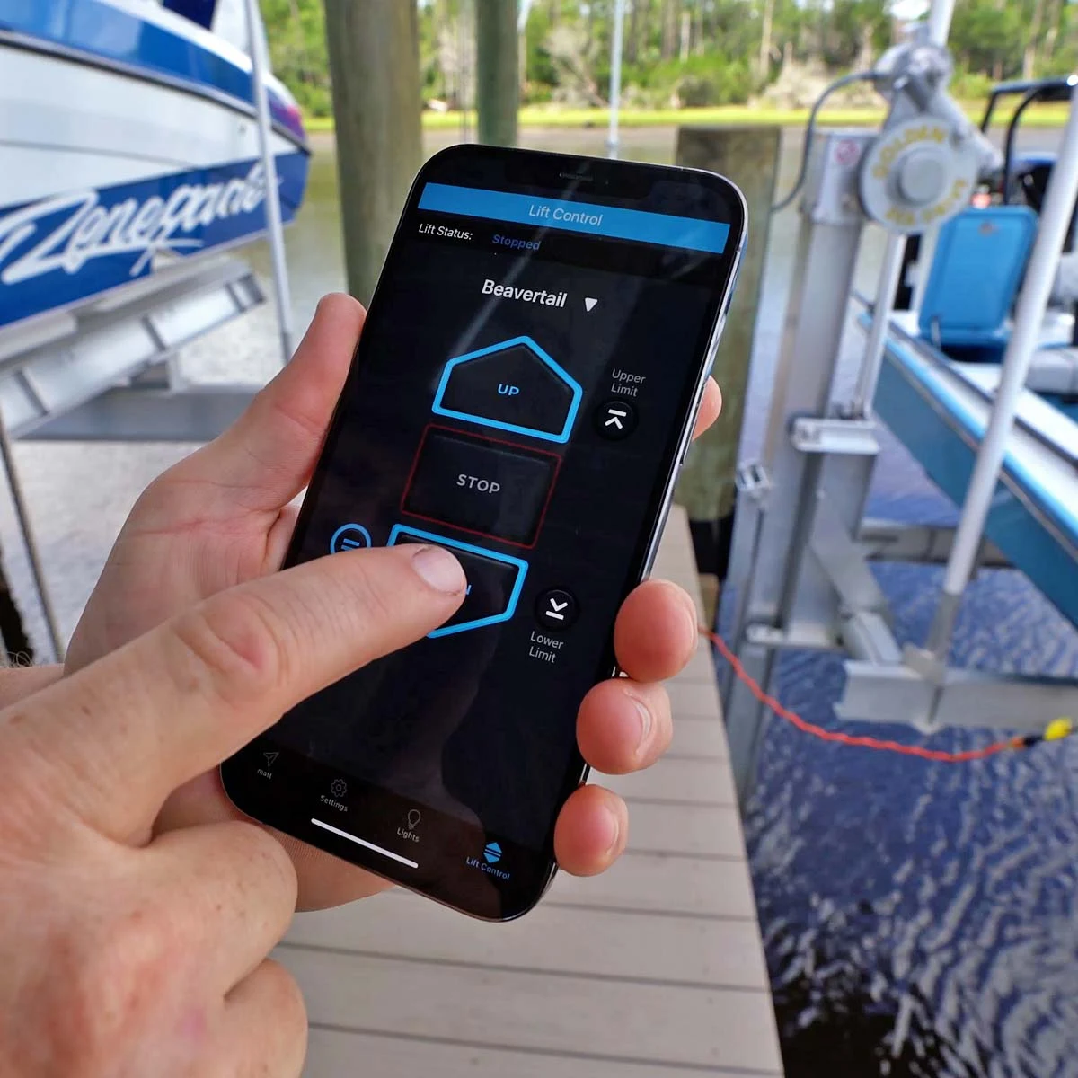 Premier Remotes directional controls on a phone aboard a boat