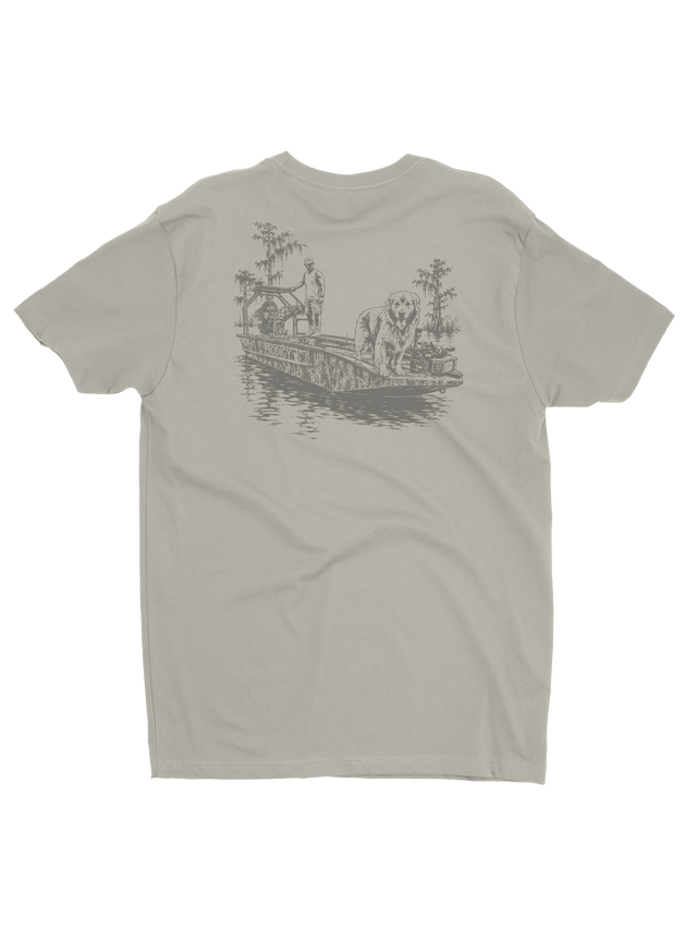 Prodigy Swamp Duo Tee in sand with an illustrated boat and dog on the back
